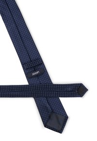 Marineblauer Schlips mit strukturiertem Muster und hellblauen Punkten. Verfügt über ein einfarbiges dunkles Innenfutter mit dem "JOOP!"-Logo auf dem Etikett.
