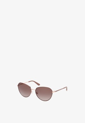 Gafas de sol aviador marrones con lentes degradados, delgados marcos de metal color oro rosado y patillas marrones con un patrón.