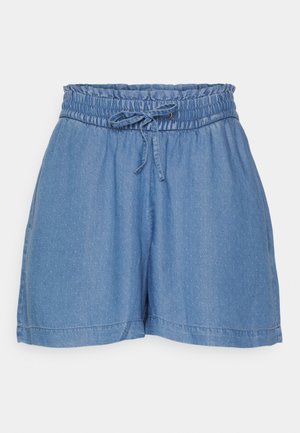Pantalones cortos de mezclilla azul claro con cinturilla elástica, cordón ajustable y pequeño patrón de lunares en todo el tejido. Diseño suave y casual.