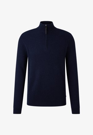 Marineblauwe geribbelde gebreide trui met lange mouwen en een korte ritssluiting aan de voorkant van de opstaande kraag.