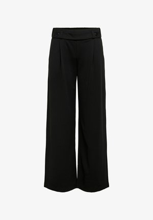 Leveälahkeiset mustat housut korkealla vyötäröllä ja napit vyötärönauhoissa, etutaitteilla ja sileällä kangaspinnalla.