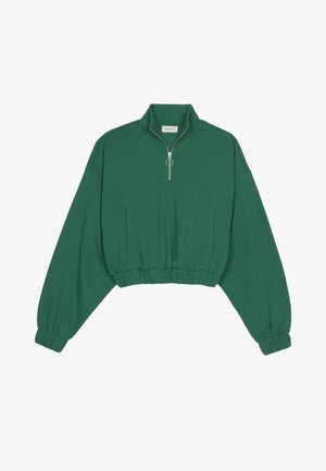 Sweatshirt vert court en tissu doux, doté d'un col zippé à moitié, de poignets élastiques et d'une coupe décontractée avec des épaules tombantes.