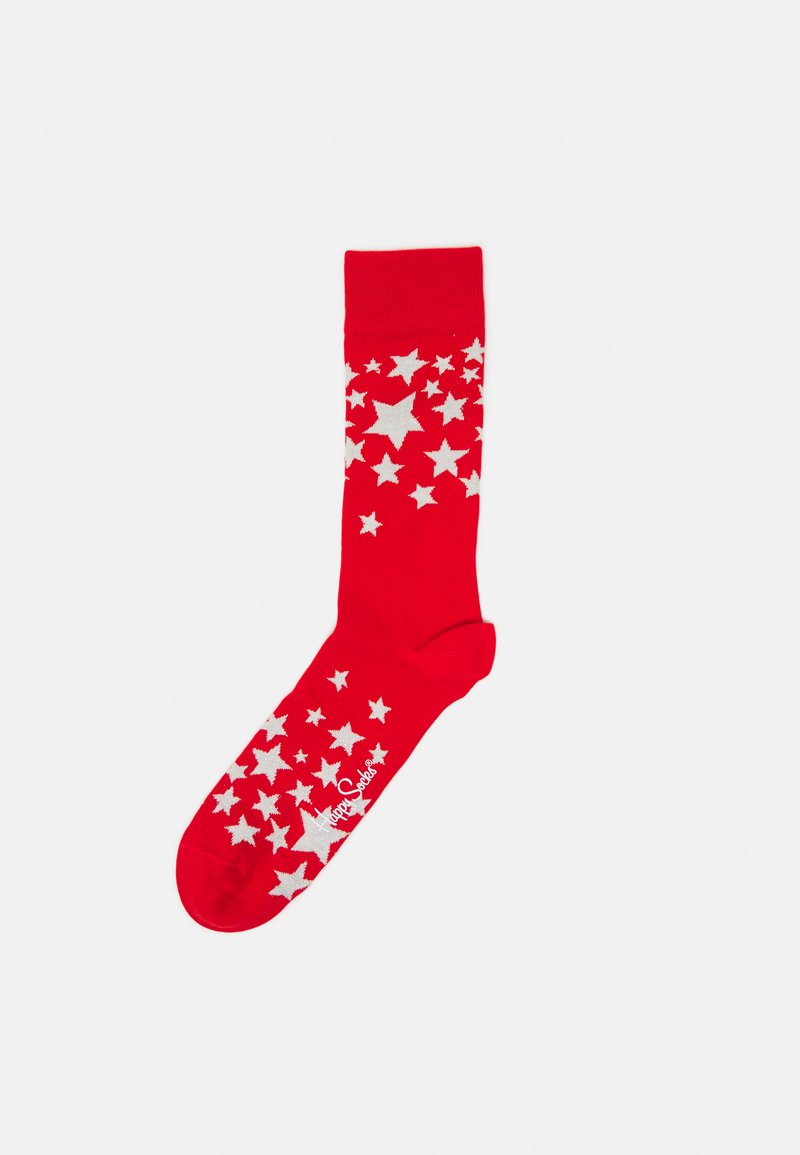 Chaussette en coton rouge avec un motif d'étoiles blanches, un bord côtelé et une texture lisse. Le nom de la marque est imprimé en blanc près des orteils.