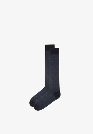 Coppia di calzini blu navy al ginocchio con piccoli motivi di ancore e punta, tallone e polsino di colore nero uniforme.