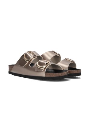 Beige slide sandals made of matte synthetic material featuring two adjustable straps with gold buckles and a cork footbed with a black rubber sole.
