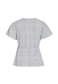 Blouse blanche à manches courtes avec un petit imprimé floral rose et vert et une ceinture cintrée à la taille, vue de dos.