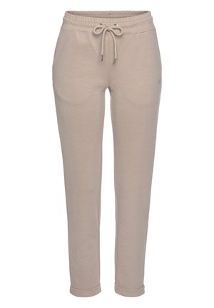 Beige Jogginghosen aus weichem Material, mit einem elastischen Bund und Kordelzug, zwei seitlichen Taschen und schmal zulaufenden Beinen mit Bündchen.