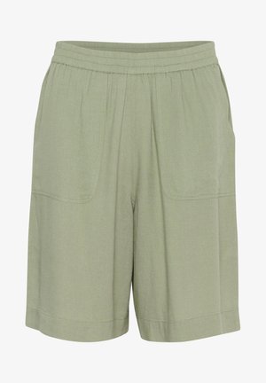 Helle grüne Shorts aus weichem Stoff mit einem elastischen Bund, ausgestattet mit zwei vorderen Taschen und einem lockeren Schnitt für mehr Komfort.