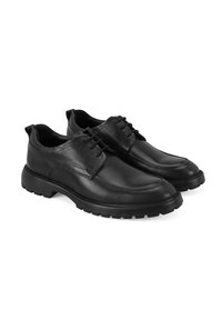 Chaussures en cuir noir avec une finition lisse, design à lacets et semelle en caoutchouc robuste. Présente un bout rond et des détails cousus.
