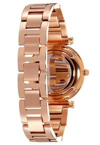 Montre Fossil avec bracelet en acier inoxydable rose doré, comportant de grands maillons polis et un boîtier rond affichant le cadran de la montre.