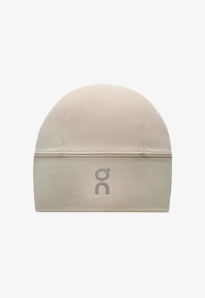 Beige running hat made of soft fabric. Fitted design with a smooth texture. Features a gray logo on the front. No visible hardware or patterns.