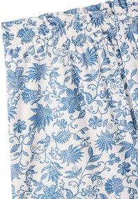 Tessuto bianco con un motivo floreale blu con dettagli intricati. Vita elastica nella parte superiore, superficie liscia.