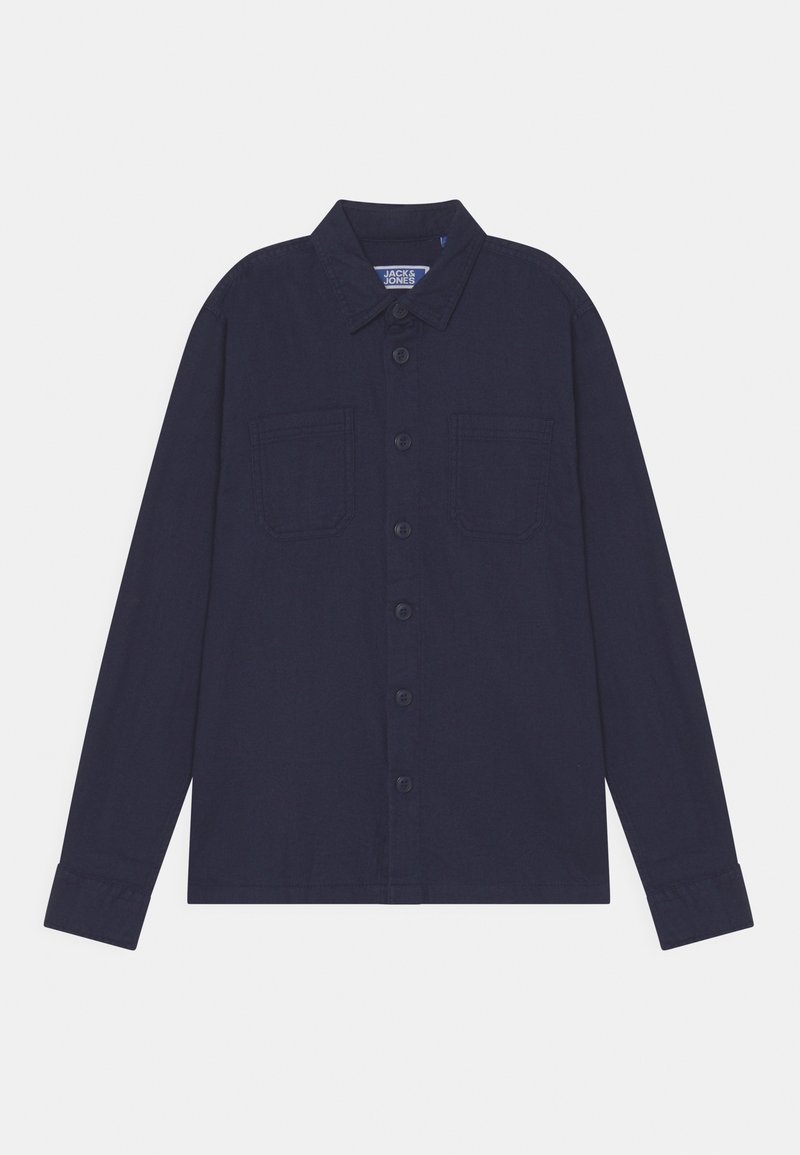 Chemise bleu marine à manches longues avec une patte de boutonnage, un col pointu et deux poches poitrine. Confectionnée dans un tissu texturé.