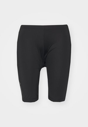 Juodi dviračių šortai pagaminti iš elastingos medžiagos. Jie turi glaudžią prigludimą, elastingą juosmenį ir siūles palei kojas. Įskaičiuotas mažas logotipo akcentas.