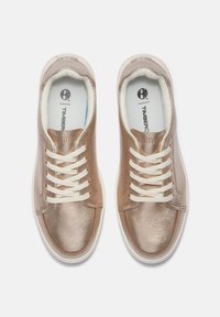 Metallic rose gold sneakers with white laces, textured leather upper, and a padded collar. Features a logo on the insole. Rounded toe shape.