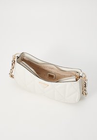 White quilted handbag with gold-tone chain strap and zippers, featuring a branded interior tag and subtle geometric pattern inside.