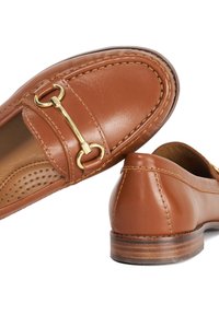 Brown leather loafer shoes with a gold-tone hardware detail, stitched accents, rounded toe, and a smooth texture.