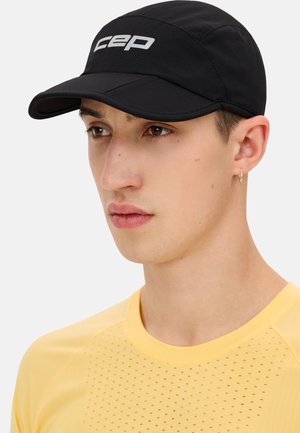Black running cap with a curved brim and white "CEP" logo. Made from lightweight fabric with mesh panels for ventilation.