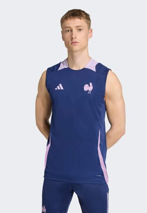 Maillot de sport sans manches marine avec des accents rose clair, un graphisme de coq et le logo Adidas à trois bandes sur l'épaule.