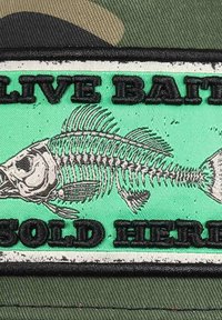 Embroidered patch featuring a fish skeleton on a mint green background, with "LIVE BAIT" and "SOLD HERE" in bold black lettering.