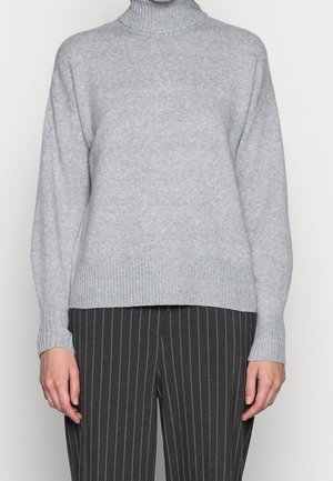 Light gray turtleneck sweater made of soft knit fabric, featuring a ribbed neckline and cuffs, with a relaxed fit. Paired with striped trousers.