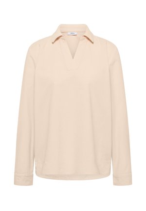 Chemise beige à manches longues avec col et ouverture en V, présentant une coupe simple et ample ainsi que des manches avec poignets.