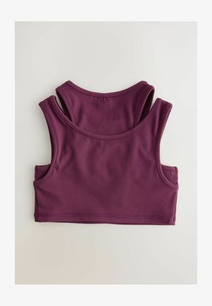 Vyno raudonas sportinis liemenukas su plačiomis petnešomis ir apvaliu iškirpimu. Minkšta, tampra medžiaga su lygiu paviršiumi ir sustiprinta siuvimo technologija.