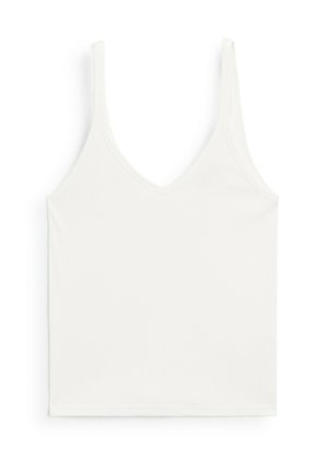 Hvid ribbet tanktop med dyb V-udskæring og tynde stropper. Den har en glat overflade og en tætsiddende pasform.