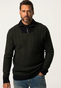 Maglione lavorato a maglia con un design testurizzato verde e nero, polsini e orlo a costine, e colletto con zip per una vestibilità regolabile.