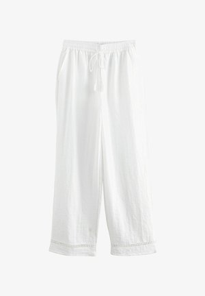 Biele, ľahké ľanové nohavice s elastickým pásom a šnúrkou. Obsahujú dve bočné vrecká a dekoračný prvok na leme.