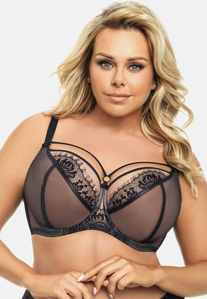 Sort lingeribrase med gennemsigtige meshpaneler, indviklet blonderdetaljer, dekorative stropper og en central accent-ring.