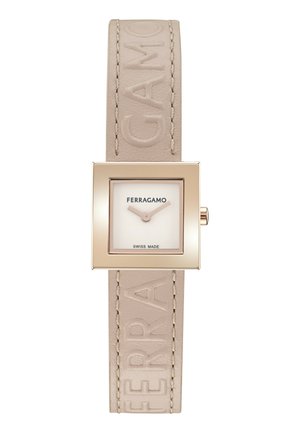 Ruudukujuline kell beige nahkristiga, millel on reljeefne "FERRAGAMO" ja kuldse tooni metallkorpus. Valgel dial'il on tekst "SWISS MADE".