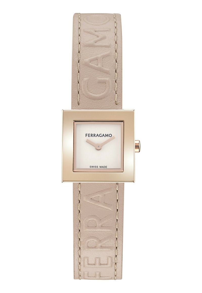 Ruudukujuline kell beige nahkristiga, millel on reljeefne "FERRAGAMO" ja kuldse tooni metallkorpus. Valgel dial'il on tekst "SWISS MADE".