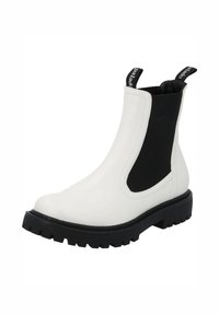 Botte Chelsea en cuir blanc avec panneaux latéraux élastiques noirs, languettes de tirage noires et semelle épaisse en caoutchouc noir.