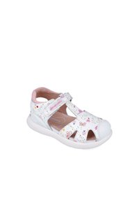 Sandalias blancas con diseño troquelado, acentos en rosa y patrones de mariposas coloridos. Elaboradas con material sintético y suela acolchada.