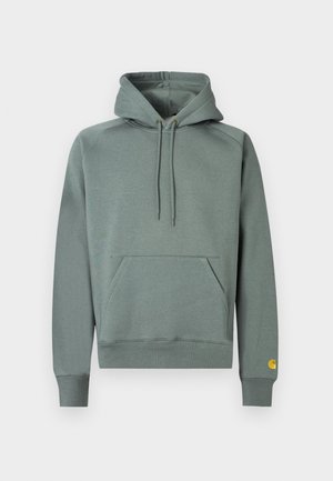 Felpa con cappuccio verde chiaro, coulisse sul cappuccio, tasca frontale, polsini e orlo a costine. Presenta un piccolo logo giallo sulla manica sinistra.