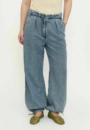 Light blue, wide-leg denim jeans with pleated front, drawstring hem, and two side pockets, featuring a single button closure.