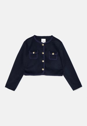 Mornarska kratka jakna s dugim rukavima, zlatnim gumbima i dva prednja džepa. Sadrži pletenu obrub oko izreza i rubova džepova.