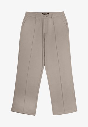 Beige platās kājas bikses izgatavotas no auduma, ar priekšējiem kabatām, rāvējslēdzēju un divām vertikālām šuvēm katrā kājā.