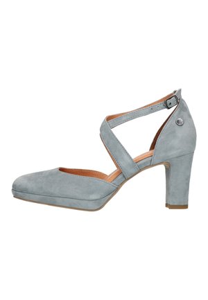 Chaussures à talons hauts en suédé bleu clair avec un bout ouvert et un design à lanières croisées. Présentent un bout arrondi et un talon bloc solide.