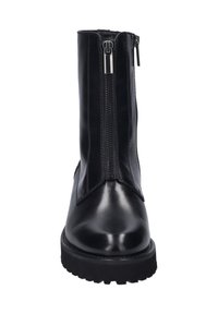 Black leather ankle boots with a zip closure at the front, sleek design, glossy texture, and a chunky tread sole for traction.