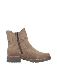 Bottines en suède marron avec une fermeture éclair sur le côté et une semelle en caoutchouc épaisse. Présente des détails cousus et un bout légèrement arrondi.