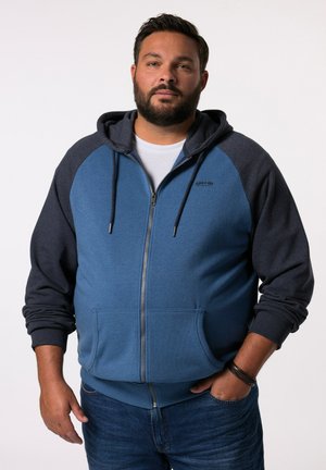 Veste à capuche zippée en bleu et gris foncé, en tissu polaire, avec poches kangourou et capuche à cordon. Design décontracté avec des poignets côtelés.