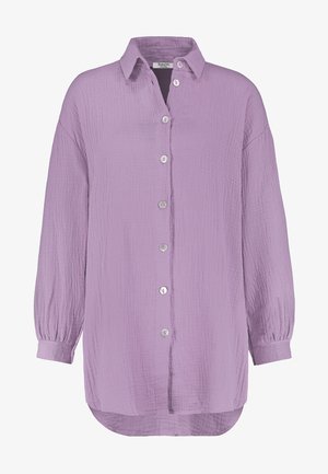 Long-sleeved, button-up shirt in light lavender, made of textured fabric with a crinkled finish and silver buttons, featuring a pointed collar.