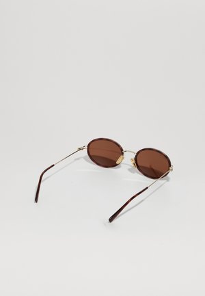 Rankning 12: Gucci - Solglasögon