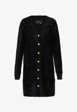 Černý huňatý dlouhý kardigan se zlatými texturovanými knoflíky vpředu a malými rozházenými kamínky poblíž ramen.