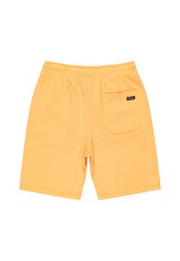 Bermudas de algodón amarillas con cintura elástica, bolsillo trasero y una etiqueta cosida en el bolsillo. Textura suave, diseño a la altura de la rodilla.
