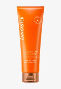 Orange plastslang med ett bronslock, märkt "Lancaster Golden Tan Maximizer", utformad för att förlänga solbrännan efter sol exponering.