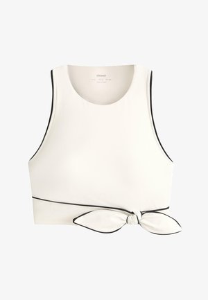 Fehér, ujjatlan, haspóló fekete szegéllyel és megkötött csomóval a jobb oldali derékrésznél.