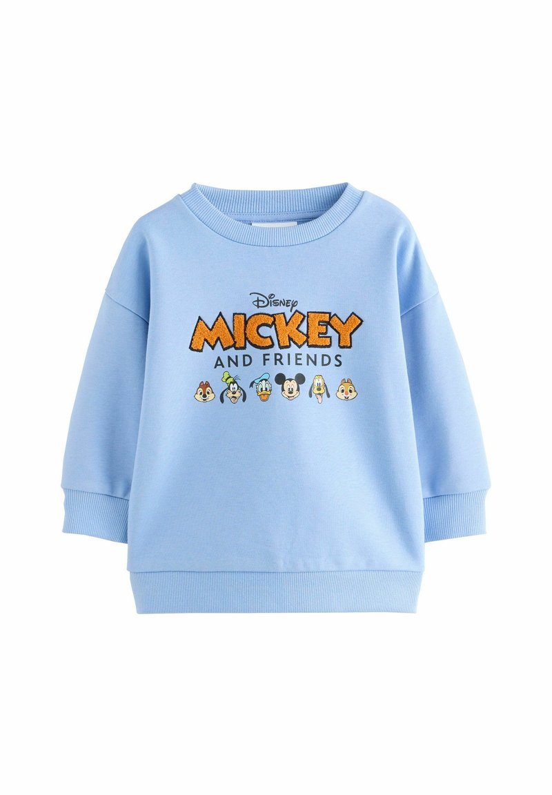 Svetlomodrá mikina s rebrovaným okrajom a manžetami. Na prednej strane sa nachádza nápis "Mickey A PRIATELIA" s grafikou kreslených postavičiek.